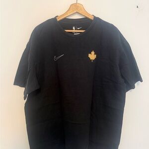 Nike Men's Black Tee with Gold Leaf Design